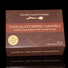 Load image into Gallery viewer, Box of Colorado Caramel Company chocolate dipped caramels on a black background