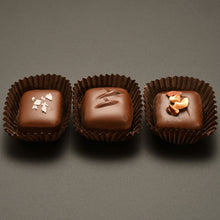 Load image into Gallery viewer, Dark chocolate dipped caramels, salted, milk chocolate, hazelnut

